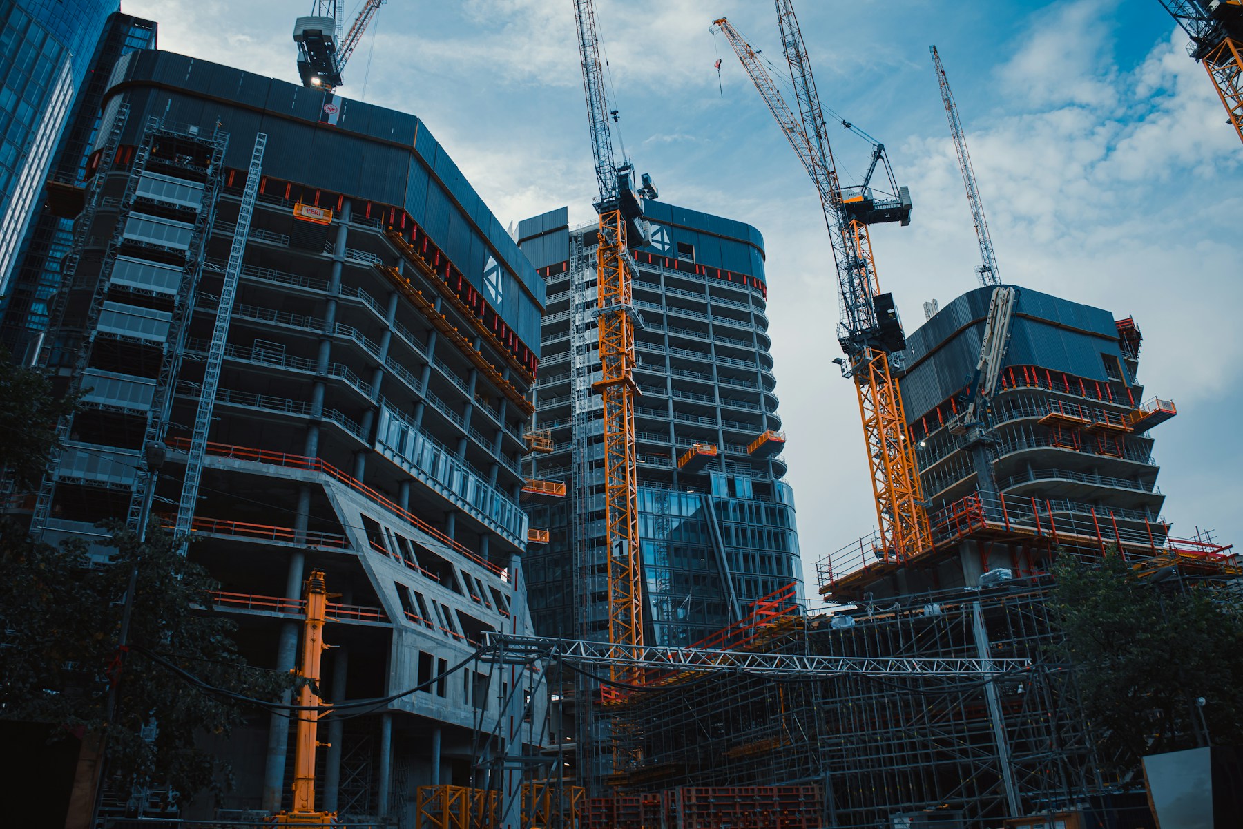 Large construction site with cranes representing structured infrastructure delivery